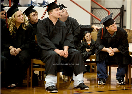 Bridgette graduated from high school in 2009.  Bri tends to stand out - or get lost - in a crowd, as is evident in this image of her with graduating classmates.  In crowded public places Bri must be protected from being bumped into or accidentally stepped upon.  