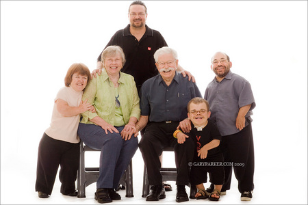 David Hill, 2nd from right, has a dwarfism type which is combination of his parents types.  Mom Shirley Hill, left, has Achondroplasia; Dad Jonathon Hill, right, has Acrolarangeal Syndrome.  Pictured with average height Grandparents and Uncle  