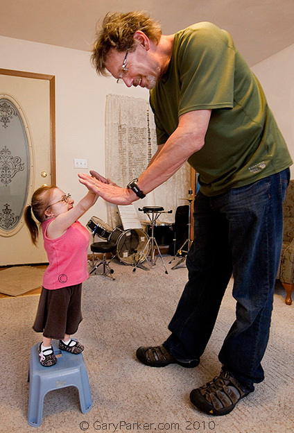 It's difficult for the average person to wrap their ears around the fact Bri, tho the size of an infant, is actually 21 years old.  Here Bri gives me a "high 5" after doing my hair... (er, after telling me "Your hair is a MESS!")  