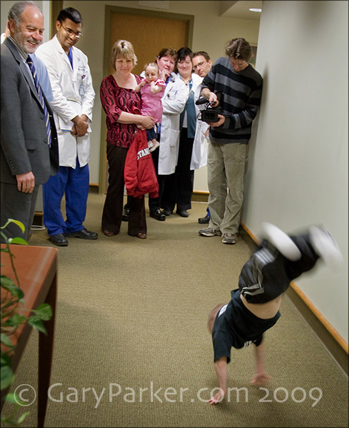 9 months after 3 brain surgeries, Brad does a run of back flips down Stanford Neurosurgery department hallways at the request of renowned neurosurgeon Dr. Gary Steinberg, at left, as  other neurosurgeons observe in disbelief.   3 weeks after this checkup, Brad won the State Championship in AAU Tumbling/Floor Exercise!!!! (the one for tall, advanced gymnasts)