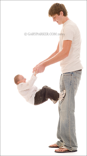 2'6"/23 pound Nick Smith, 17, climbs his older brother Travis, , 20, 6'5".   Nick has Primordial Dwarfism type MOPD II.  Nick has average stature siblings and parents.