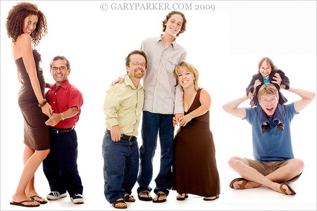 Jenaya McGowan, 6'2", left, pictured with Dr. Ghassan Hallak, a 4'4" physician. At right is Primordial Dwarf Stephanie Mayhugh, 31, one of smallest women in the world.  At center Tracey & Kevin Thompson, achondroplasia, with their average stature son Wyatt.