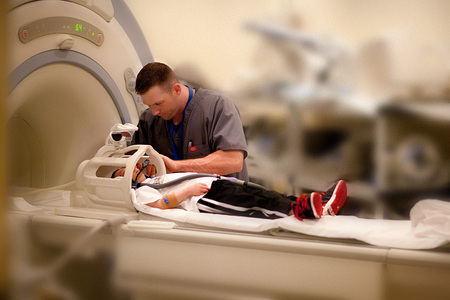 Brad Jordan, 18, being prepped for an MRI at Lucille Packard's Children Hospital at Stanford University.  Brad, a 35 pound Primordial Dwarf, won the state championship in Tumbling - the one for TALL advanced athletes - only 9 months after 3 brain surgeries at Stanford.